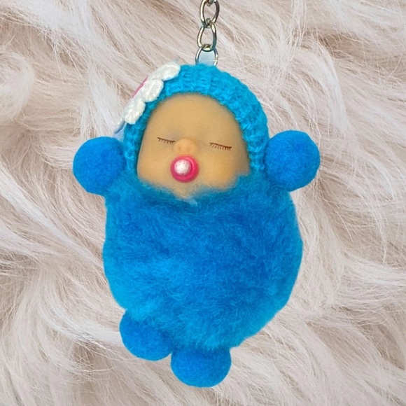 SLEEPY BABY WITH PACIFIER SMALL POMPON IN BLUE KEYCHAIN CHARM - Picture 1 of 6